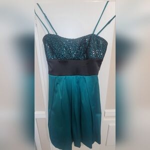 Green Junior dress with net on top with black sequence.
